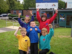 Children showing the colours of our School Uniform